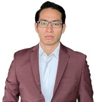 Cristopher Nimatuj in a maroon suit